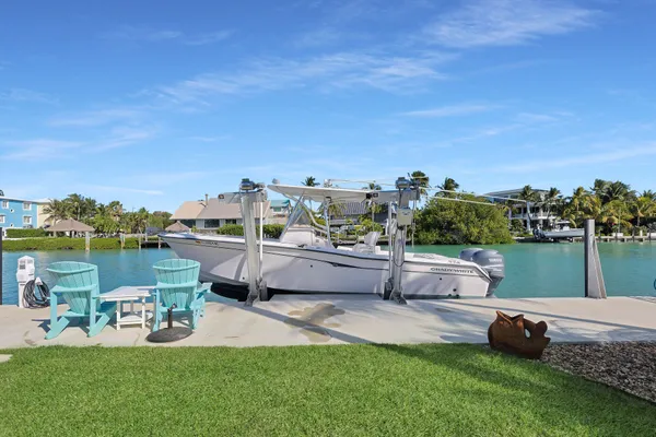 a view of house with swimming pool yard and outdoor seating