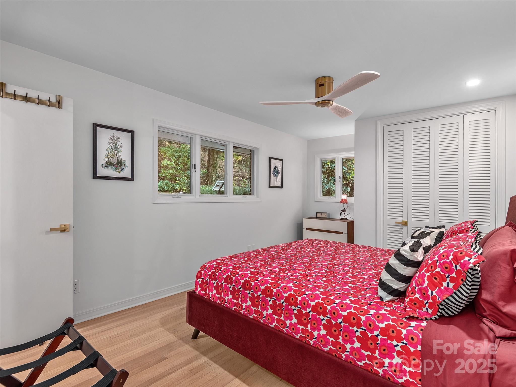 51 Rice Branch Road Asheville, NC 28804 - Photo 18 of 48 a bedroom with a large bed and a window