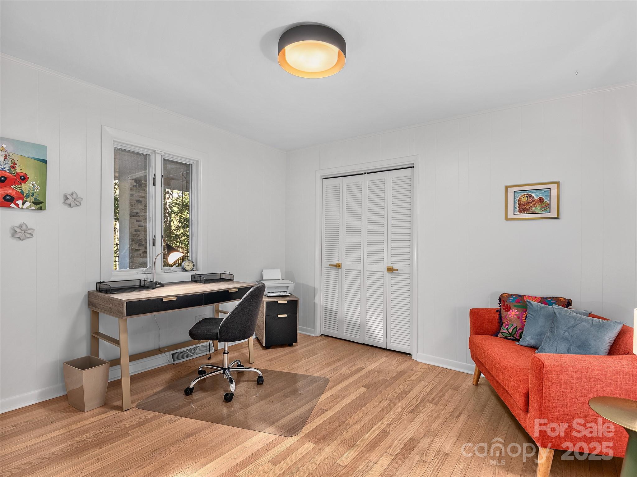 51 Rice Branch Road Asheville, NC 28804 - Photo 23 of 48 a view of a workspace with furniture and a window
