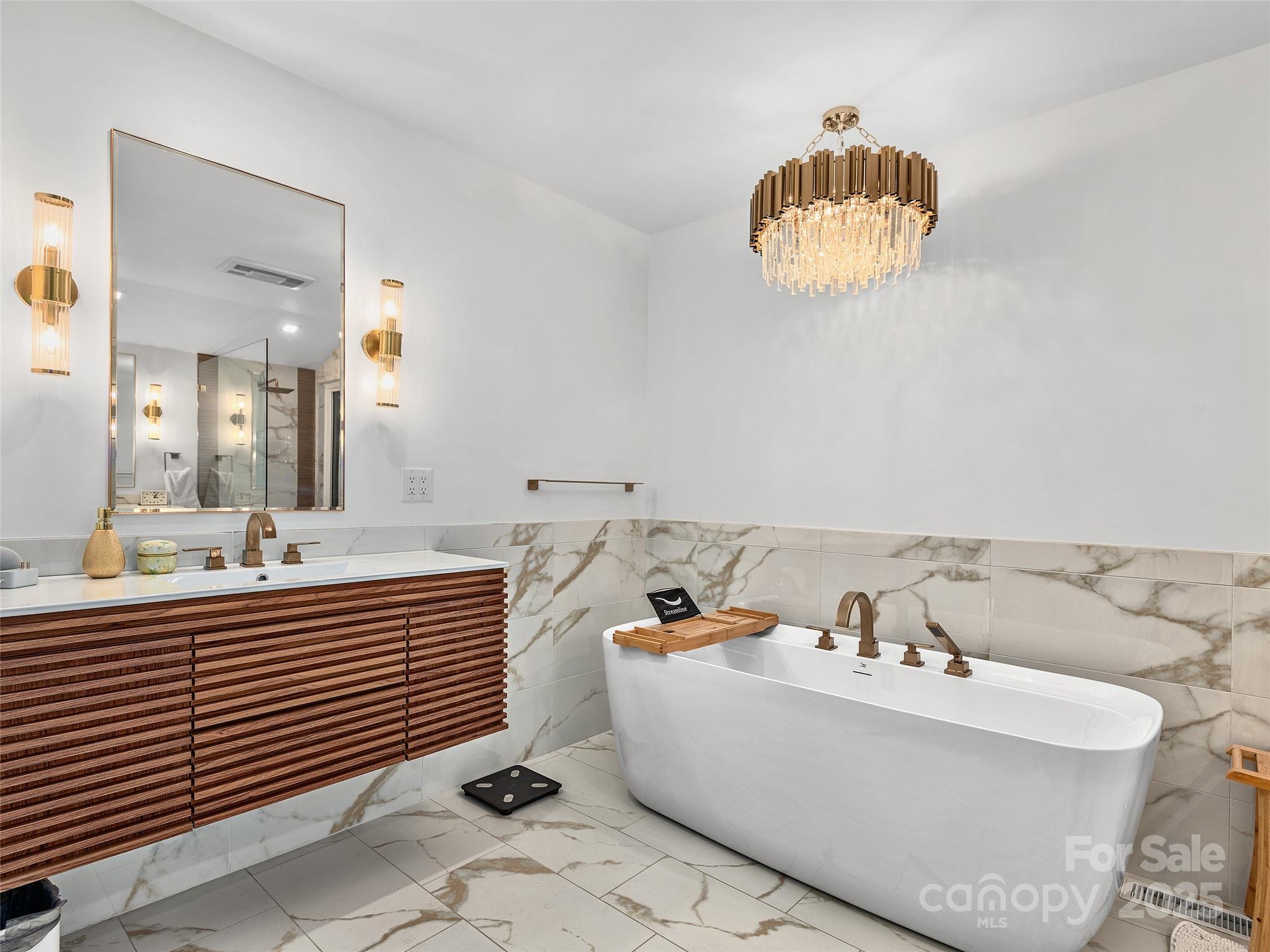 51 Rice Branch Road Asheville, NC 28804 - Photo 28 of 48 a bathroom with a bathtub and a sink