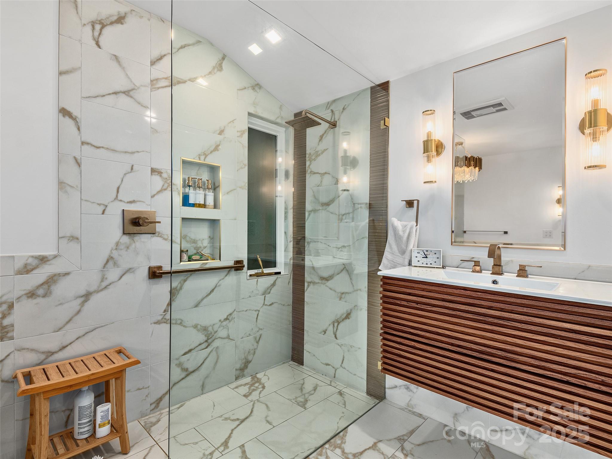 51 Rice Branch Road Asheville, NC 28804 - Photo 29 of 48 a bathroom with a sink mirror and shower