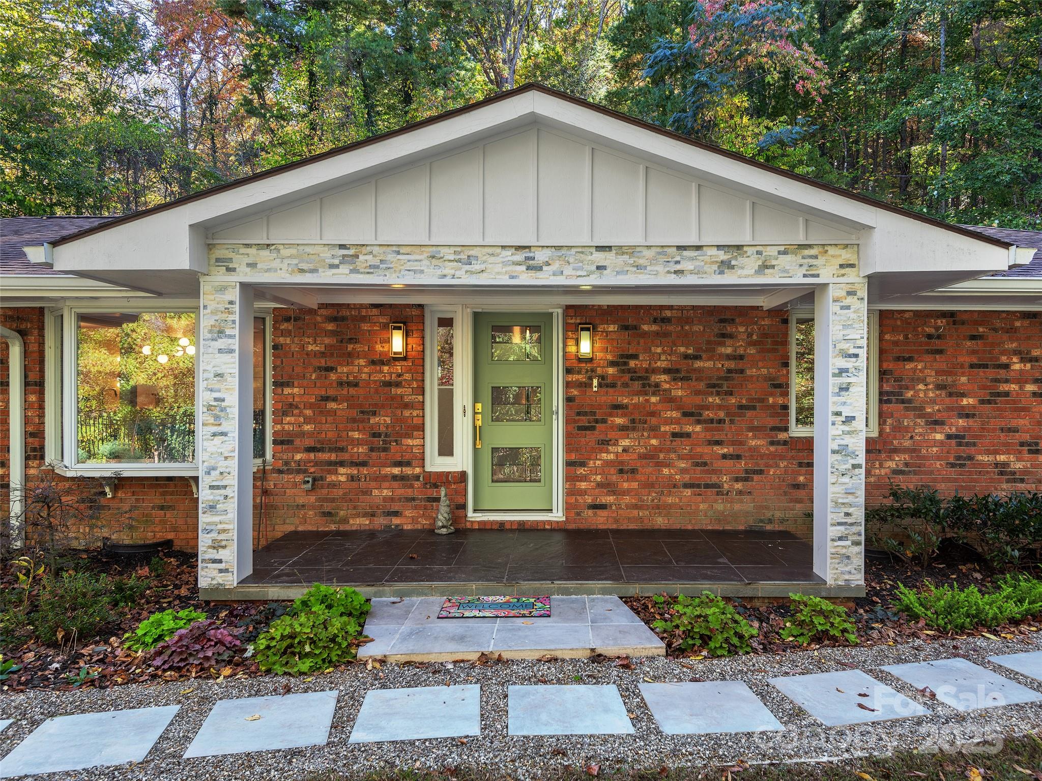 51 Rice Branch Road Asheville, NC 28804 - Photo 3 of 48 a front view of a house with garden