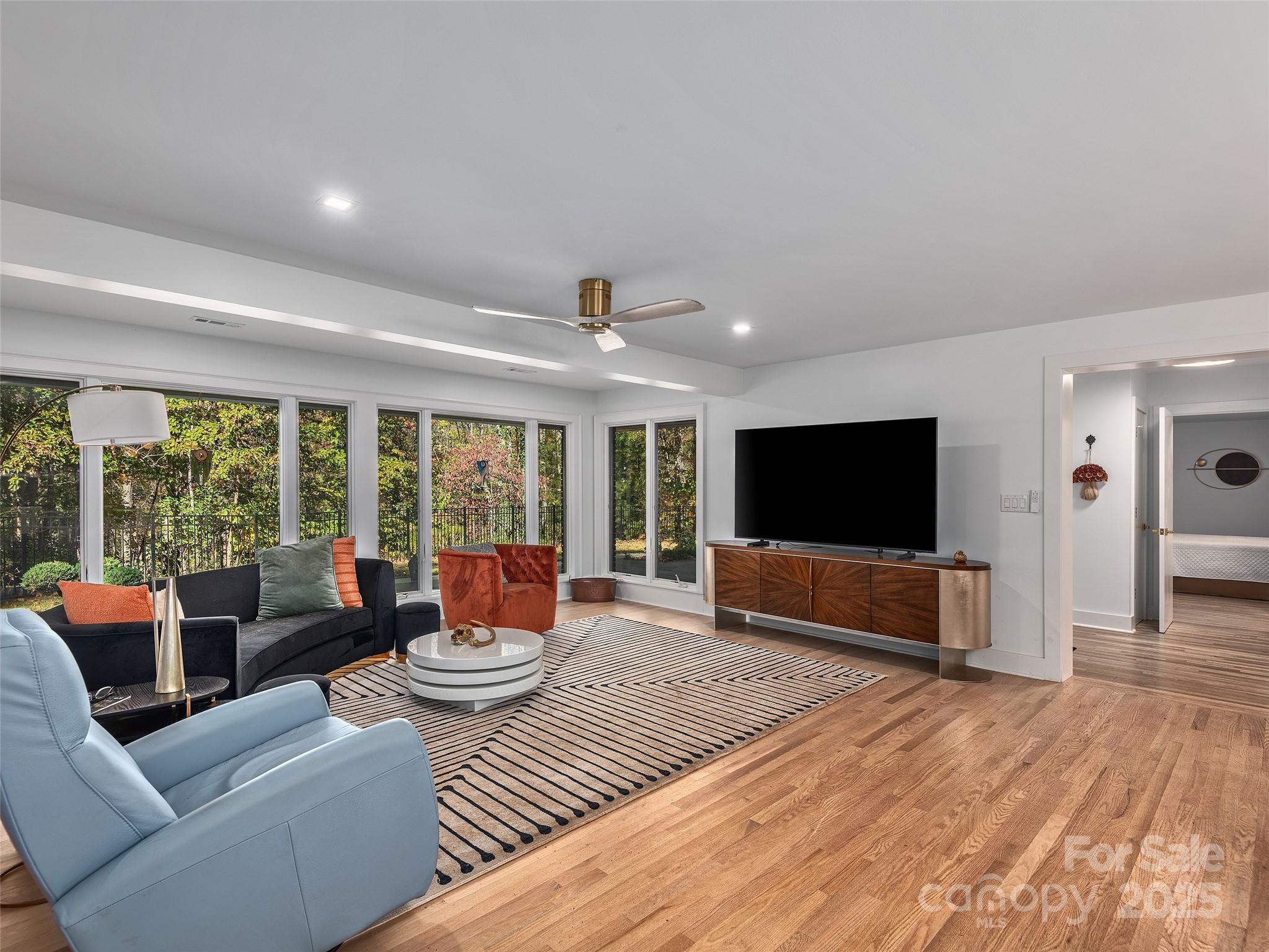 51 Rice Branch Road Asheville, NC 28804 - Photo 5 of 48 a living room with furniture and a flat screen tv