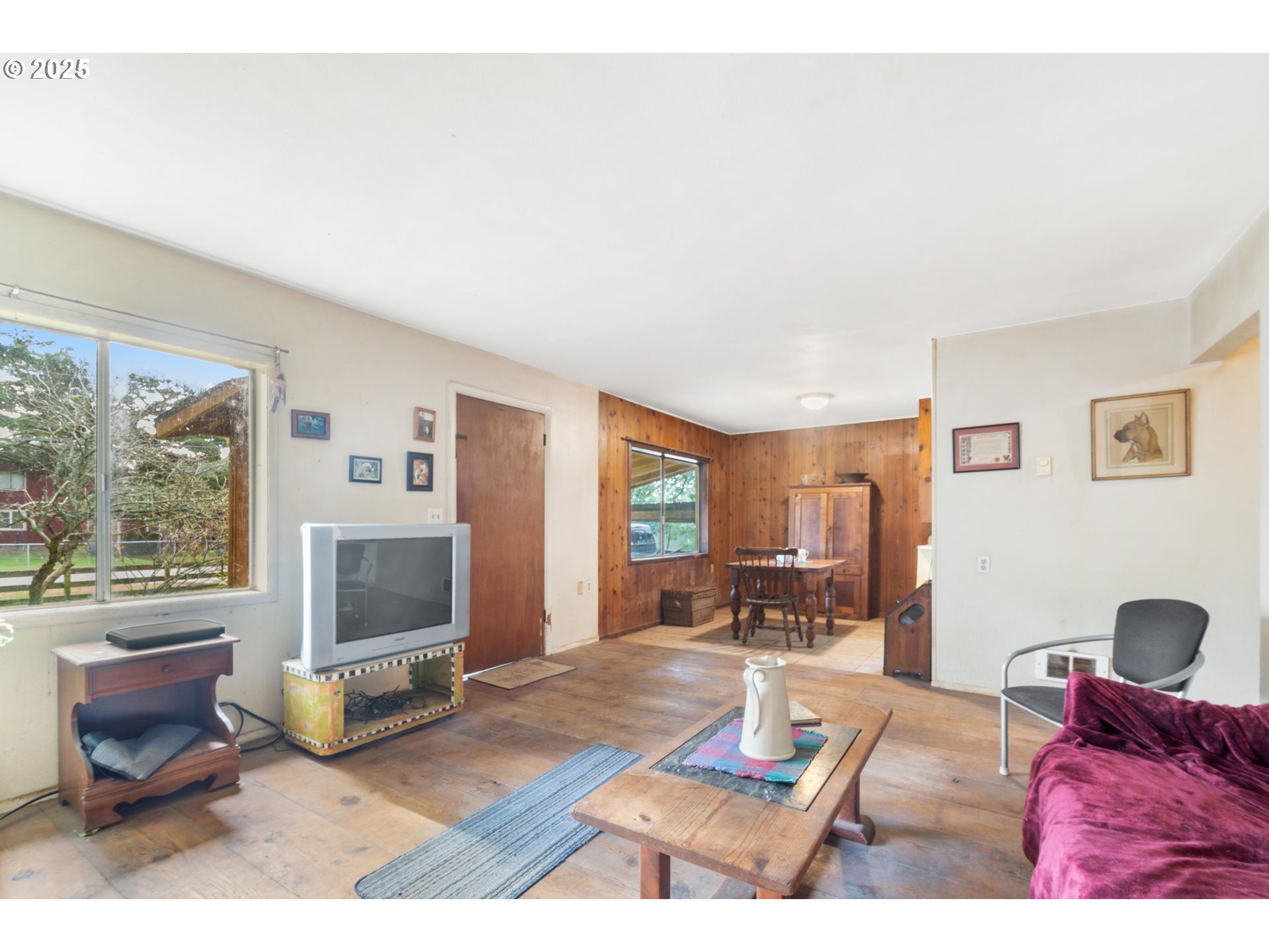 628 13th Street Port Orford, OR 97465 - Photo 5 of 10 a living room with furniture a flat screen tv and a fireplace