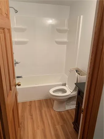 a front view of a house with a large window