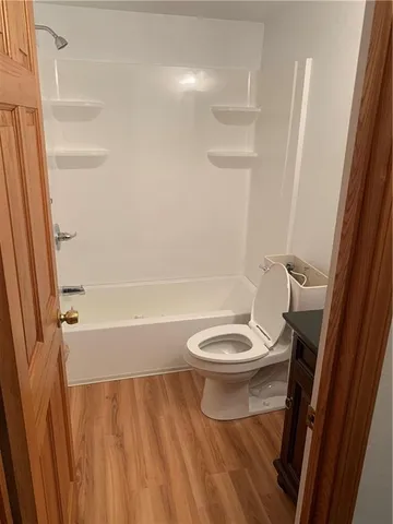 a front view of a house with a large window