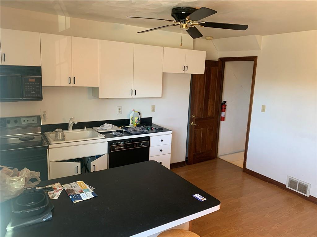 380 Northgate Drive, Unit D Apollo, PA 15613 - Photo 3 of 13 a kitchen with a refrigerator and a stove top oven