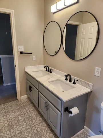 a bathroom with a sink and a mirror