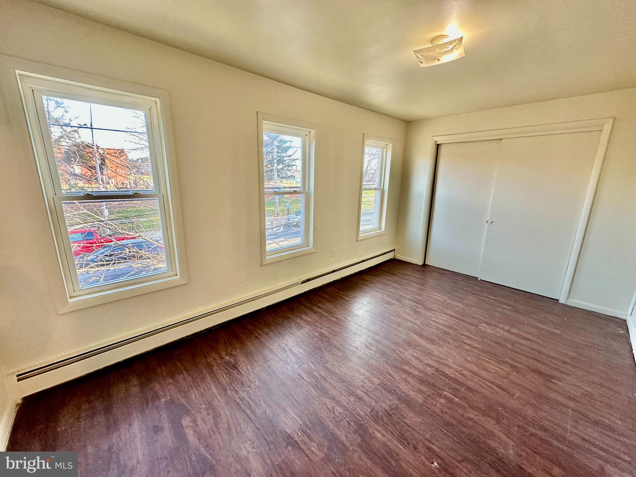 520 South Duke Street Lancaster, PA 17602 - Photo 5 of 13 a view of an empty room with wooden floor and a window