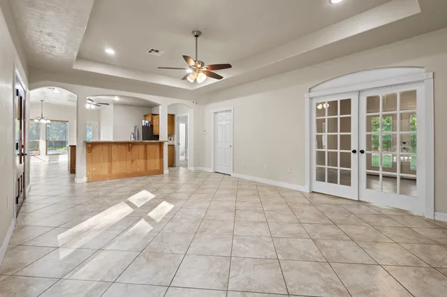 a bedroom with a large bed and a window