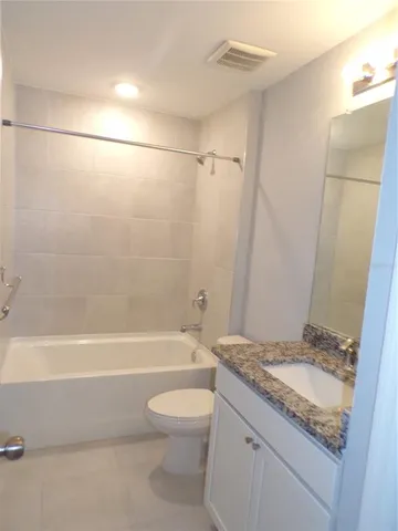 a front view of house with yard and trees