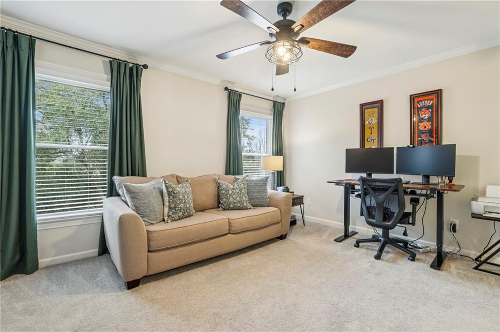 7500 Roswell Road, Unit 24 Sandy Springs, GA 30350 - Photo 19 of 45 a living room with furniture and a window