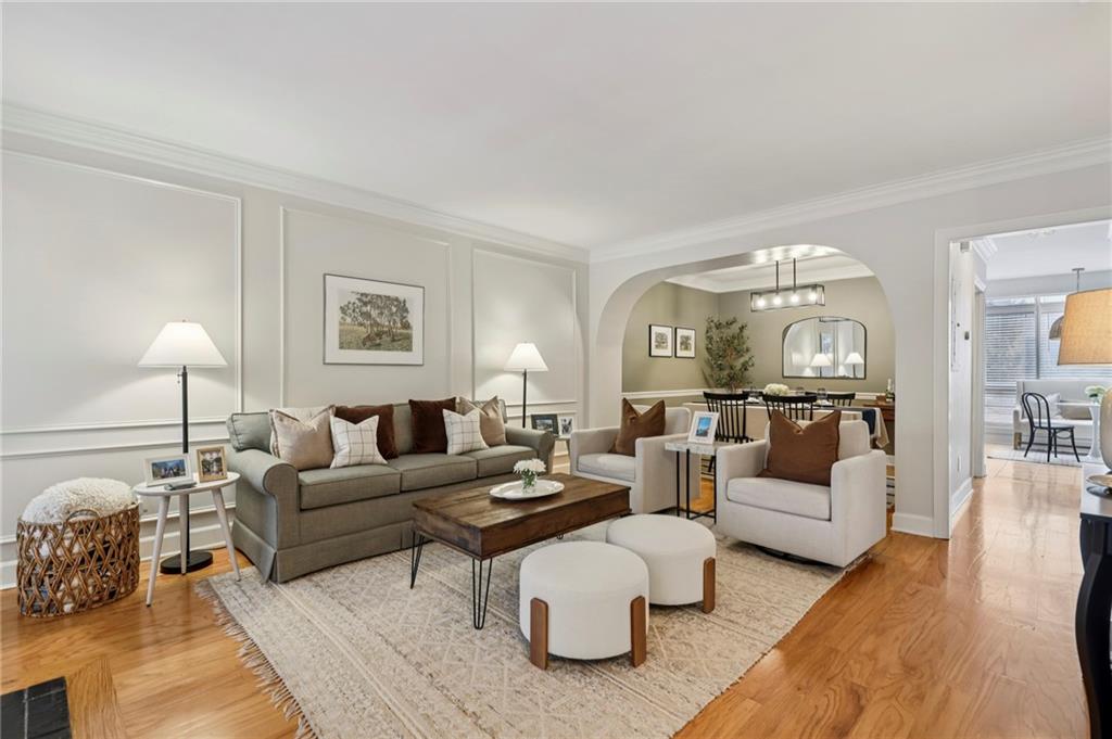 7500 Roswell Road, Unit 24 Sandy Springs, GA 30350 - Photo 3 of 45 a living room with furniture and a lamp