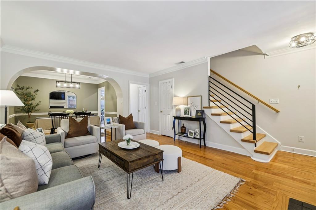 7500 Roswell Road, Unit 24 Sandy Springs, GA 30350 - Photo 4 of 45 a living room with furniture and a wooden floor