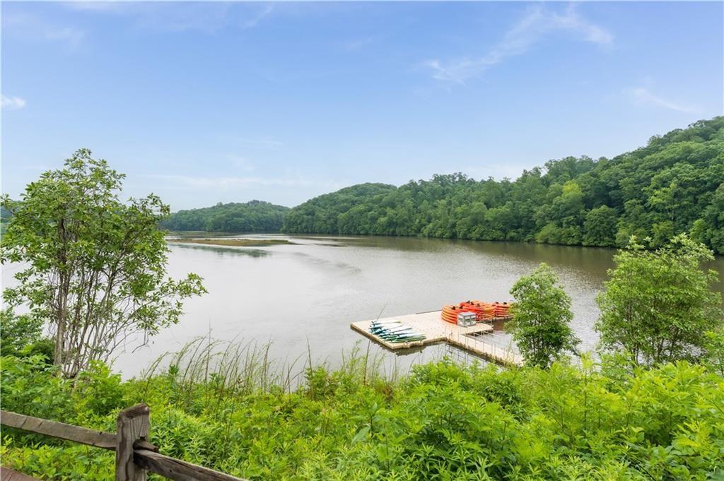 7500 Roswell Road, Unit 24 Sandy Springs, GA 30350 - Photo 44 of 45 a body of water with a tree in the background