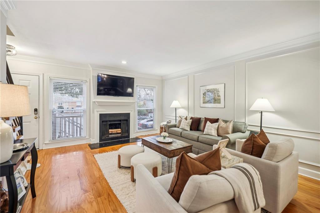 7500 Roswell Road, Unit 24 Sandy Springs, GA 30350 - Photo 6 of 45 a living room with furniture and a fireplace