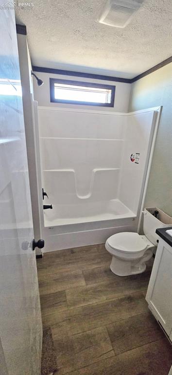 7075 North Ramah Highway Yoder, CO 80864 - Photo 12 of 13 a bathroom with a toilet and a shower