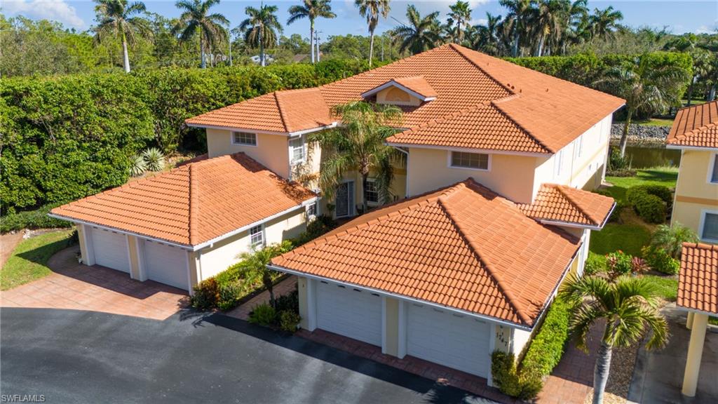 1747 Reuven Circle, Unit 1703 Naples, FL 34112 - Photo 17 of 31 an aerial view of a house