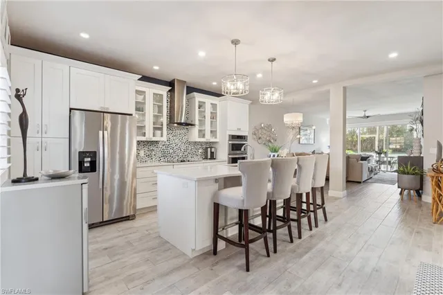 a large kitchen with a table and chairs