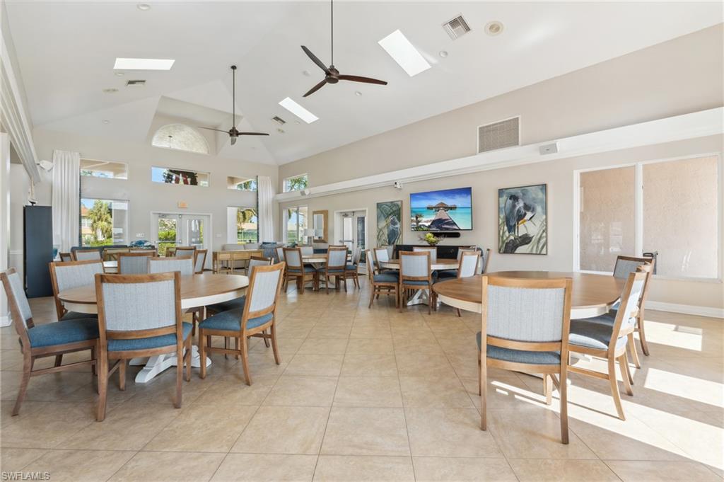 1747 Reuven Circle, Unit 1703 Naples, FL 34112 - Photo 24 of 31 a outdoor space with lots of tables a view and chairs