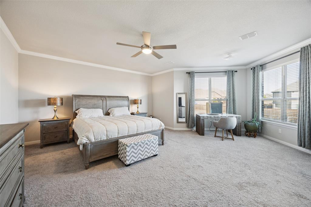 1701 Long Meadow Road Wylie, TX 75098 - Photo 13 of 30 a bedroom with a bed and a couch