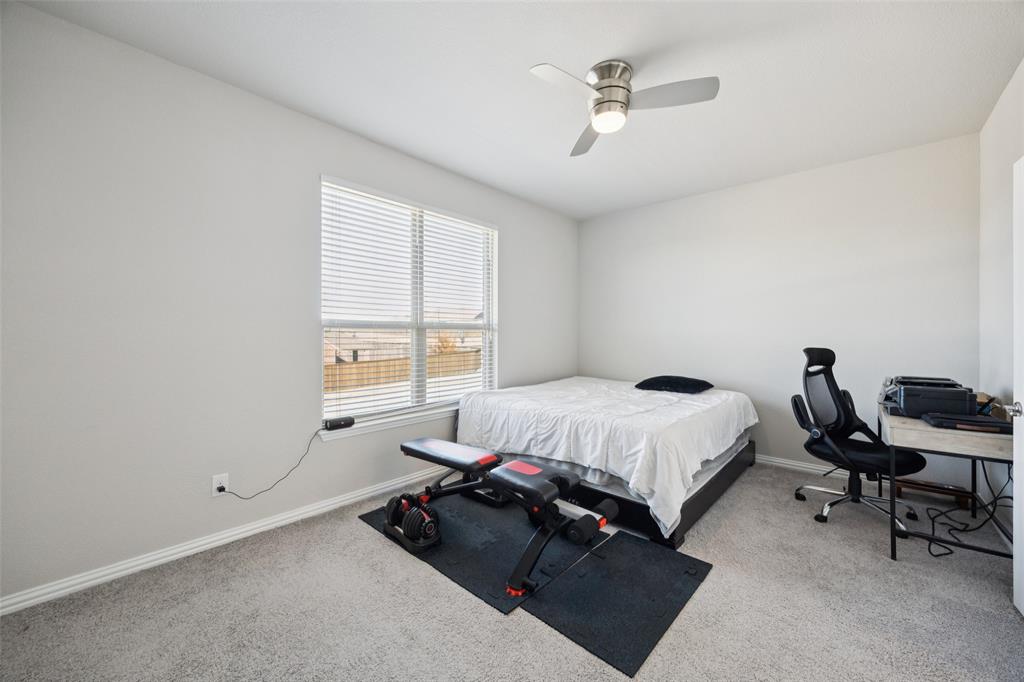 1701 Long Meadow Road Wylie, TX 75098 - Photo 21 of 30 a bedroom with a bed and a window