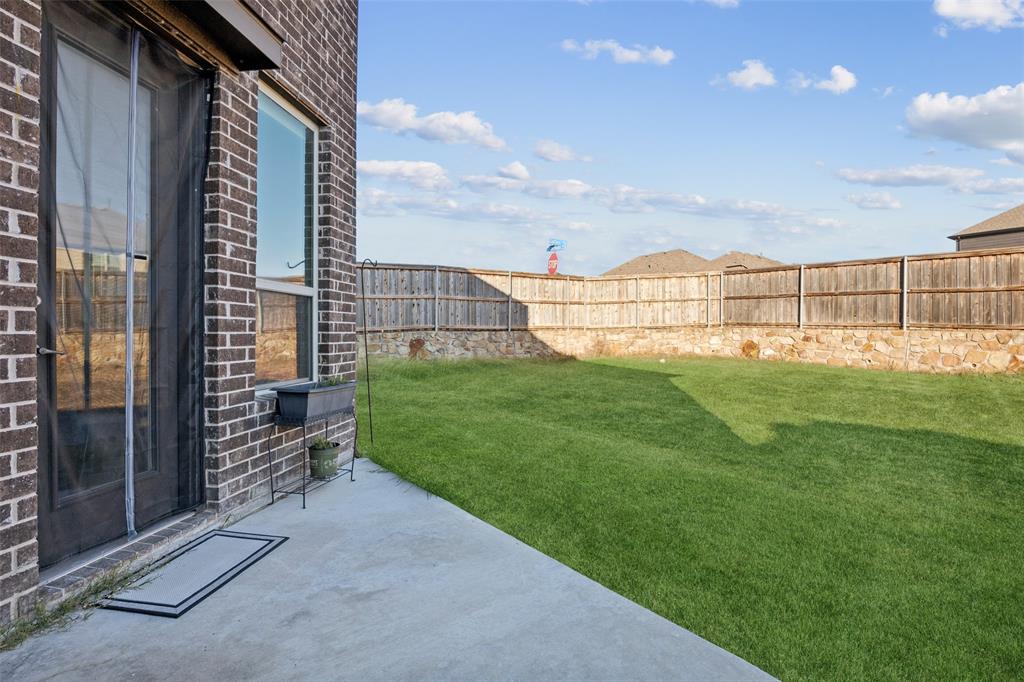 1701 Long Meadow Road Wylie, TX 75098 - Photo 23 of 30 a view of a back yard of the house