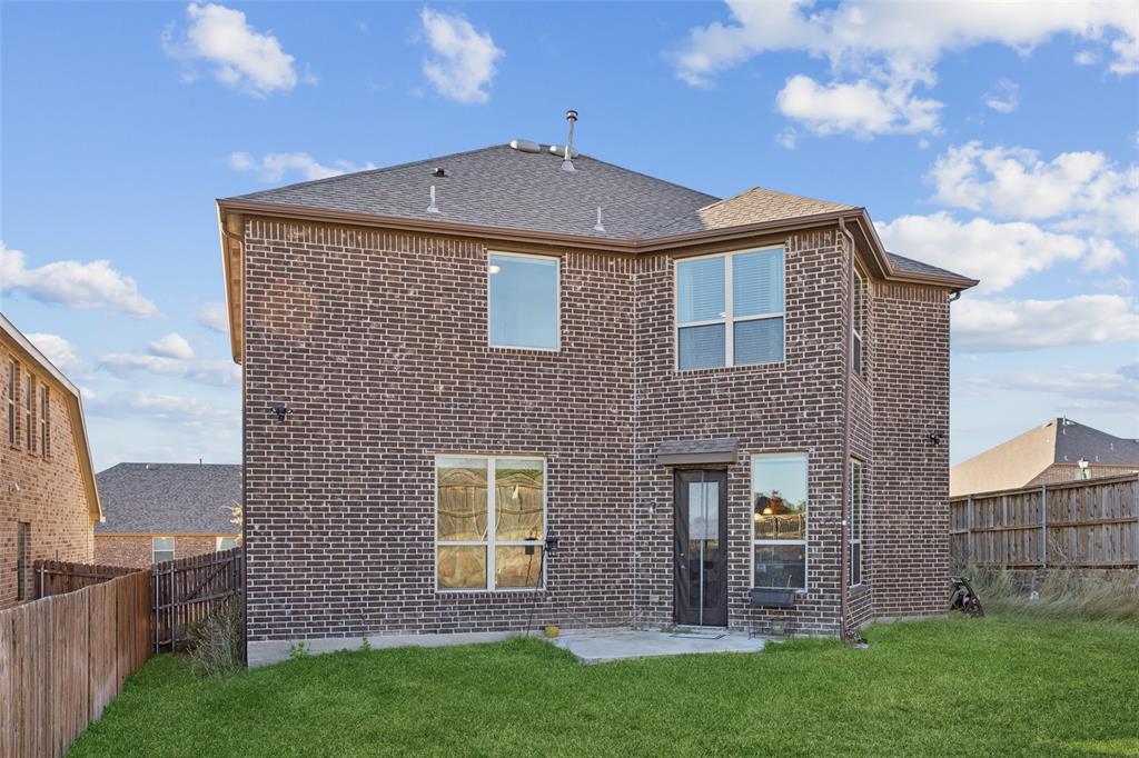 1701 Long Meadow Road Wylie, TX 75098 - Photo 25 of 30 a front view of a house with garden