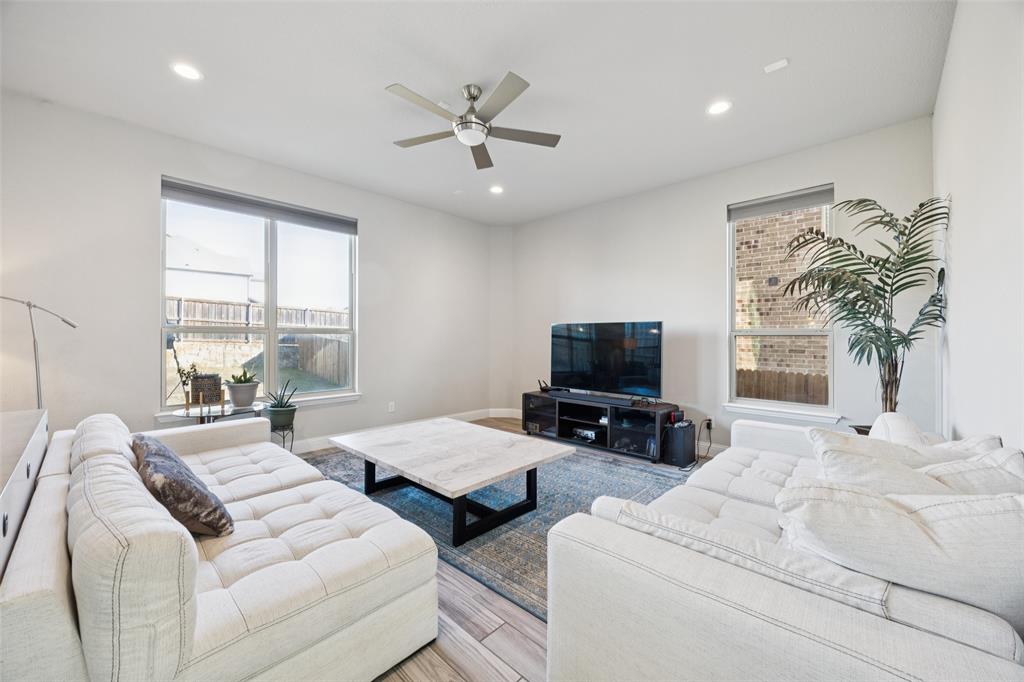 1701 Long Meadow Road Wylie, TX 75098 - Photo 5 of 30 a bedroom with two beds and a flat screen tv