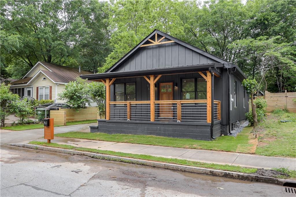 963 Sims Street Southwest Atlanta, GA 30310 - Photo 1 of 1 a front view of a house with a yard