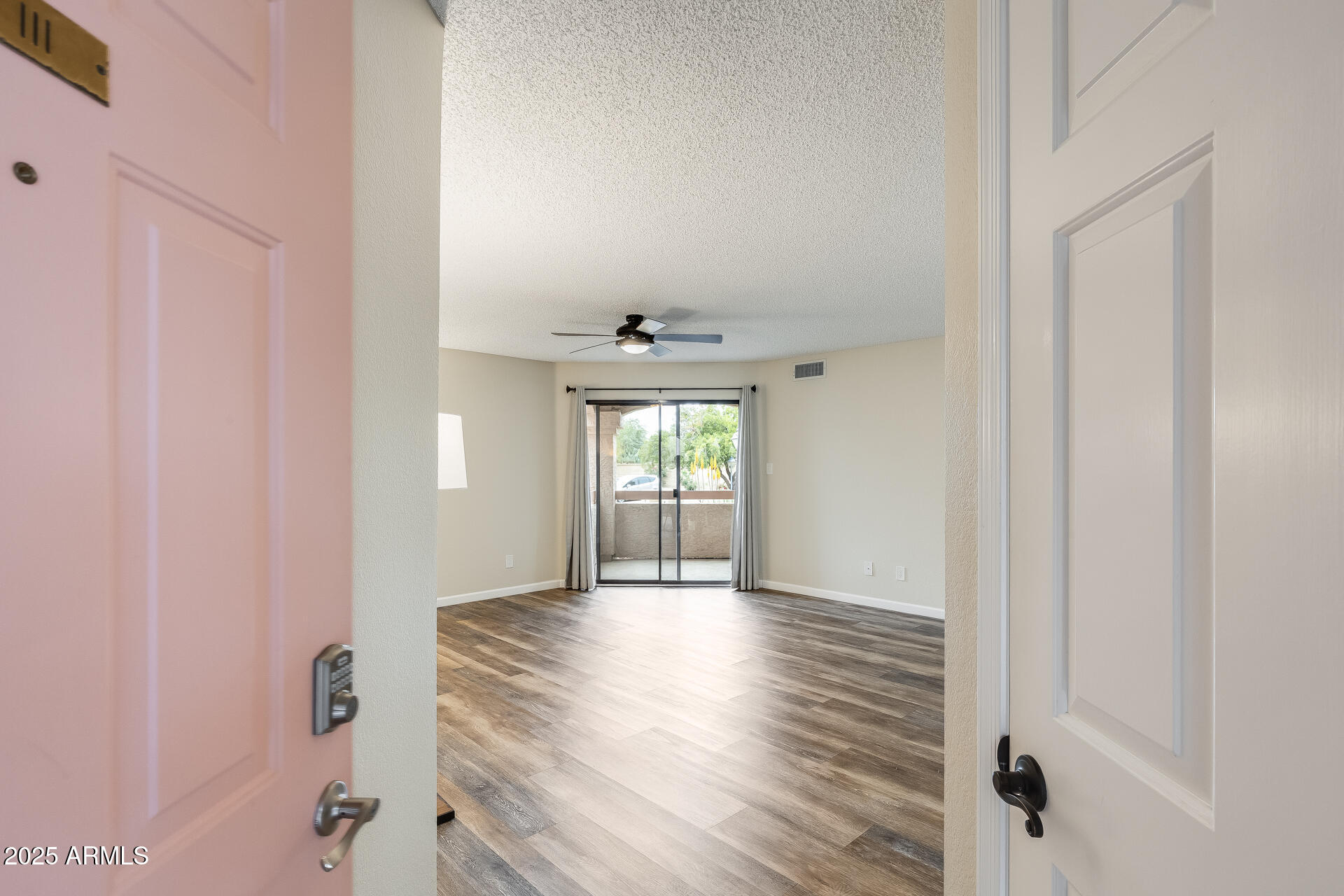9151 West Greenway Road, Unit 111 Peoria, AZ 85381 - Photo 10 of 45 a view of an empty room and window