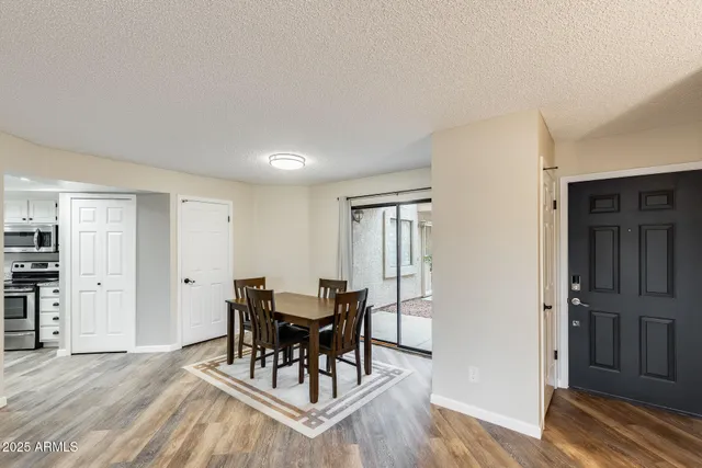 a view of a dining room with furniture and wooden floor