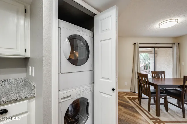 a view of a livingroom with furniture and a flat screen tv