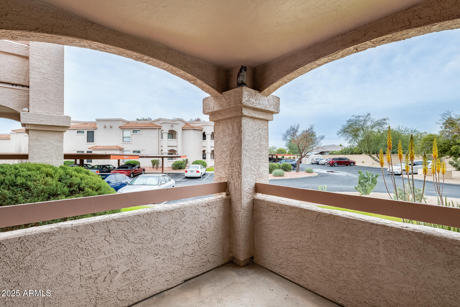9151 West Greenway Road, Unit 111 Peoria, AZ 85381 - Photo 34 of 45 a view of a building from a balcony