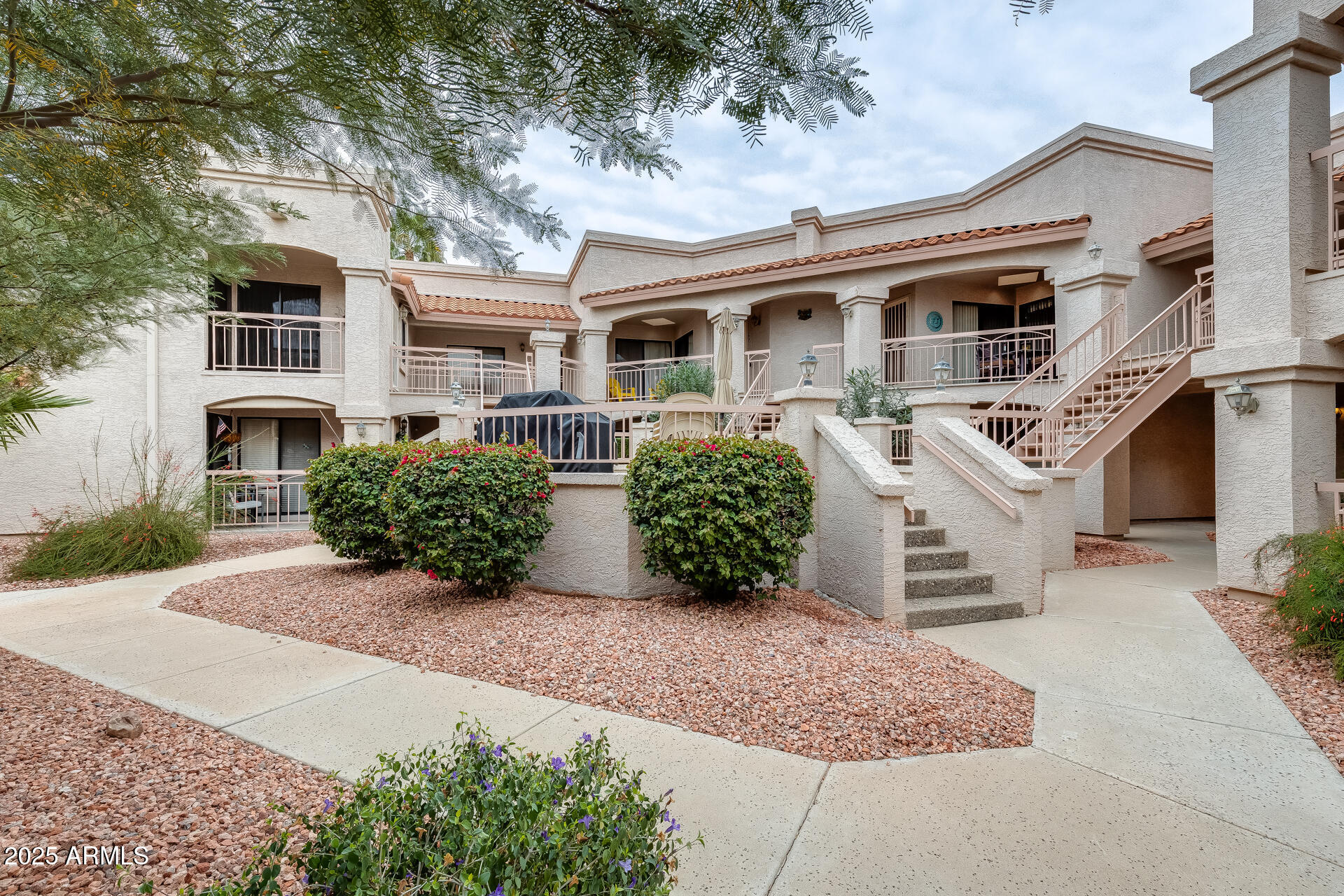 9151 West Greenway Road, Unit 111 Peoria, AZ 85381 - Photo 5 of 45 front view of a house with a yard