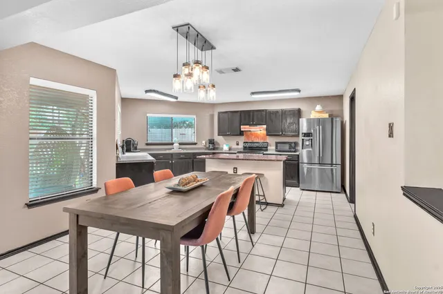 a view of a dining room with furniture window and outside view