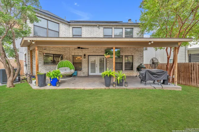 a front view of house with outdoor seating and yard