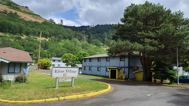 a swimming pool with outdoor seating and yard