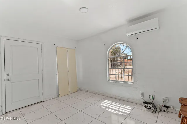 a view of empty room with windows