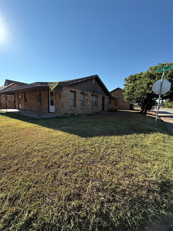1849 South 14th Street Abilene, TX 79602 - Photo 4 of 8 a view of a house with a yard
