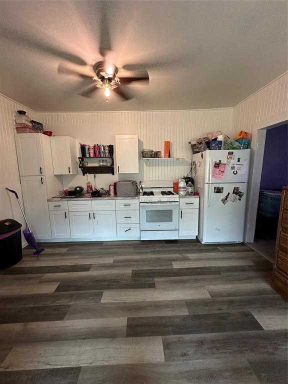1849 South 14th Street Abilene, TX 79602 - Photo 7 of 8 a view of storage and utility room with refrigerator and ceiling fan