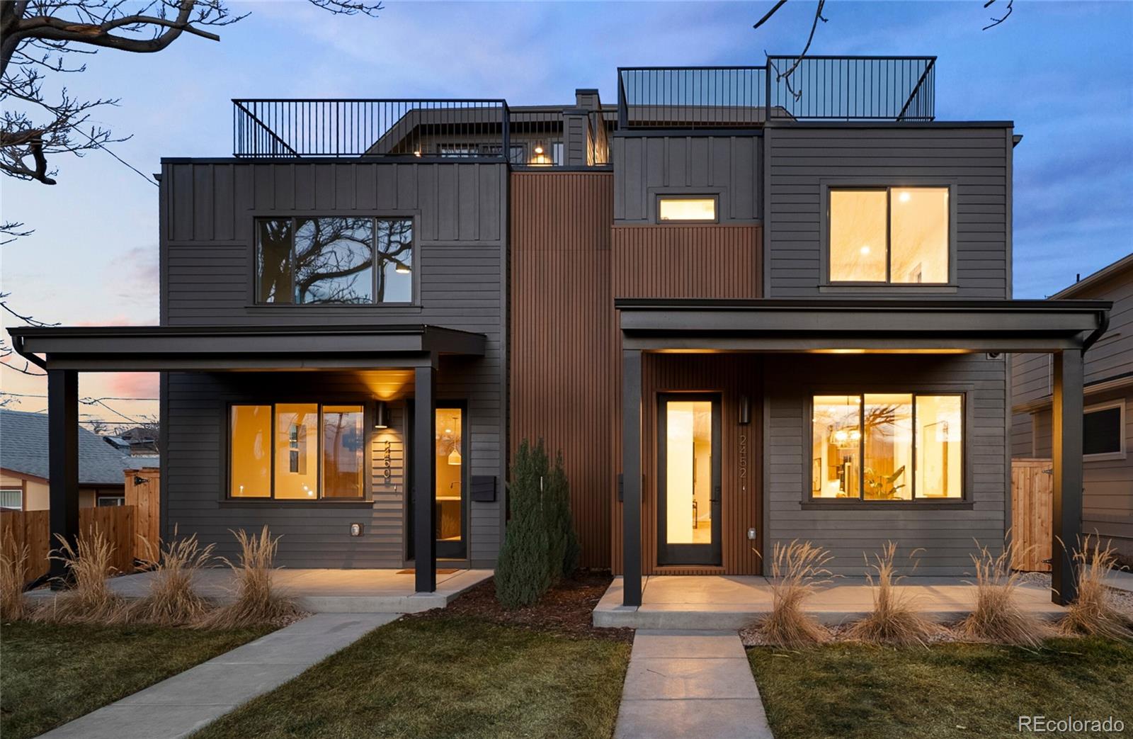 2452 South Cherokee Street Denver, CO 80223 - Photo 1 of 34 a front view of a house with a yard
