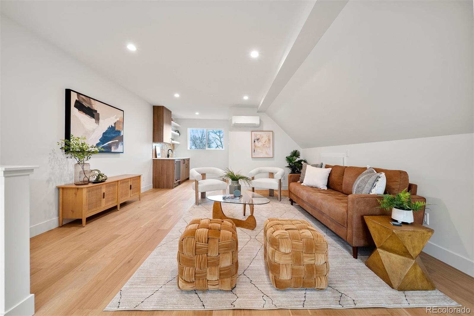 2452 South Cherokee Street Denver, CO 80223 - Photo 21 of 34 a living room with furniture and wooden floor