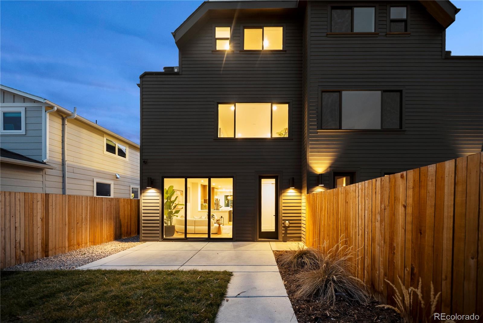 2452 South Cherokee Street Denver, CO 80223 - Photo 33 of 34 a front view of a house with a yard