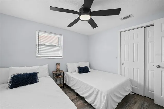 a view of a swimming pool and lounge chairs