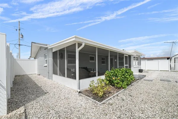 a view of a house with outdoor space and sitting area