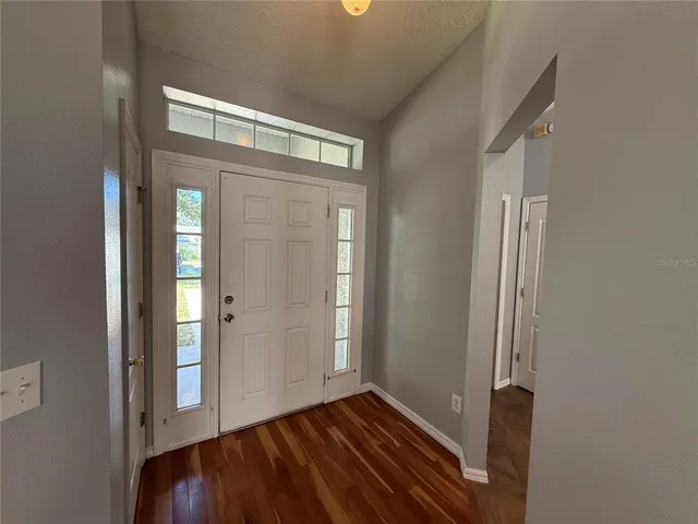a view of entryway with wooden floor