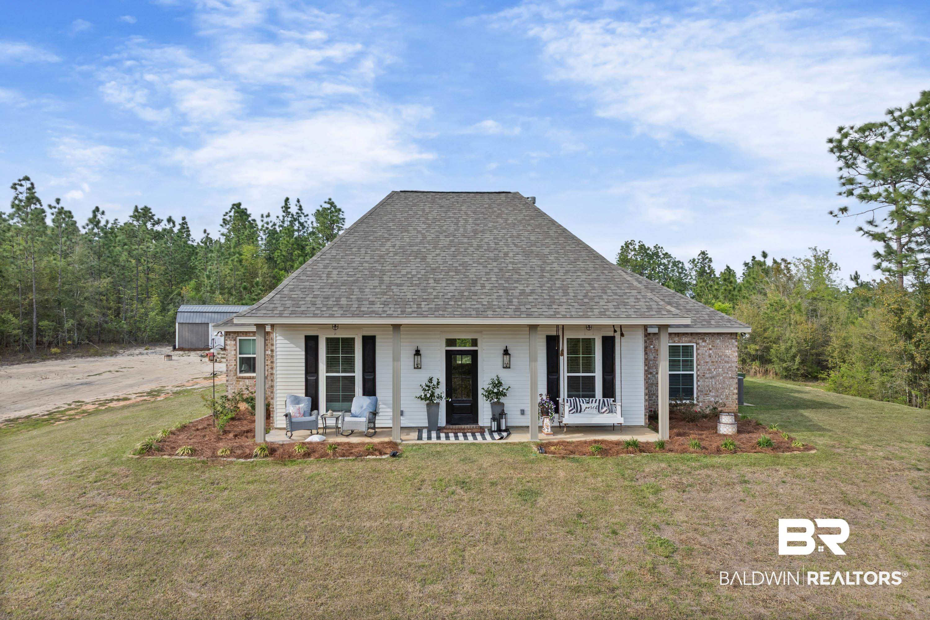 7150 Powell Road, Unit LOT 6A Eight Mile, AL 36613 - Photo 2 of 35 View of front of home with a porch, a front yard, and roof with shingles