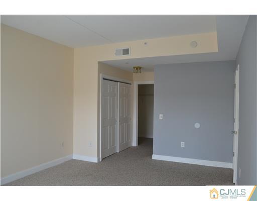 358 Rector Street, Unit 608 Perth Amboy, NJ 08861 - Photo 14 of 24 a view interior of house and hall with wooden floor