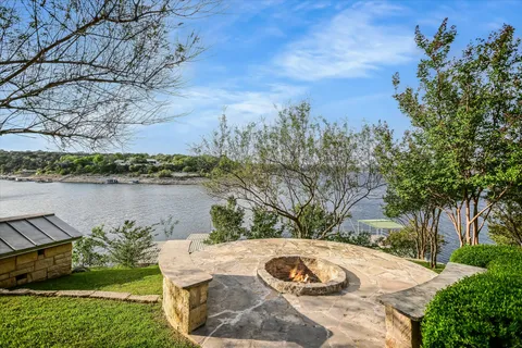 a view of a lake with a yard